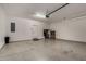 Clean and spacious two car garage with epoxy flooring, ample storage, and direct access to the house at 4548 S Renaissance Dr # 103, Gilbert, AZ 85297