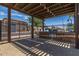 Community grill area featuring a built-in grill, stone accents, and a shaded pergola at 4548 S Renaissance Dr # 103, Gilbert, AZ 85297
