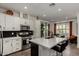 Well-equipped kitchen with stainless steel appliances, sleek countertops, and a stylish island with seating at 4548 S Renaissance Dr # 103, Gilbert, AZ 85297