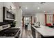 Bright open kitchen with stainless steel appliances, black backsplash and breakfast bar at 4548 S Renaissance Dr # 103, Gilbert, AZ 85297