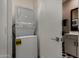 Laundry nook with stacked washer and dryer at 4548 S Renaissance Dr # 103, Gilbert, AZ 85297