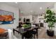 Bright, open-concept living space with modern finishes and stylish decor, seamlessly connecting the kitchen and dining areas at 4548 S Renaissance Dr # 103, Gilbert, AZ 85297