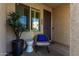 Cozy front patio with comfortable seating, perfect for relaxing and enjoying the neighborhood views at 4548 S Renaissance Dr # 103, Gilbert, AZ 85297
