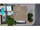 This aerial view shows a house with a pool, green grass, and a large covered patio at 4822 N 63Rd Ln, Phoenix, AZ 85033