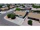 An aerial view showcases a charming home with a neatly manicured lawn and mature trees in a Gathering-friendly neighborhood at 4822 N 63Rd Ln, Phoenix, AZ 85033