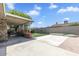 Spacious backyard features a covered patio, concrete area, and artificial grass at 4822 N 63Rd Ln, Phoenix, AZ 85033
