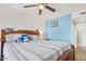 Bedroom with a blue accent wall and a stuffed animal arrangement on the bed at 4822 N 63Rd Ln, Phoenix, AZ 85033