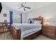 This is a bedroom with a ceiling fan and some stuffed animals on the bed at 4822 N 63Rd Ln, Phoenix, AZ 85033