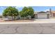 Charming single-story home with mature trees and well-maintained landscaping at 4822 N 63Rd Ln, Phoenix, AZ 85033