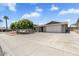 Spacious single-story home with a wide driveway and mature landscaping at 4822 N 63Rd Ln, Phoenix, AZ 85033