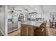 Charming kitchen with granite counters, stainless appliances, and white cabinetry at 4822 N 63Rd Ln, Phoenix, AZ 85033