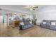 Open concept living space with kitchen view, tile flooring, and comfortable seating area at 4822 N 63Rd Ln, Phoenix, AZ 85033