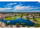 Stunning aerial view showcases the community lake, lush golf course, and scenic neighborhood at 515 S Saguaro Way, Mesa, AZ 85208