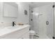 Modern bathroom featuring a glass-enclosed shower with tile surround and modern fixtures at 515 S Saguaro Way, Mesa, AZ 85208