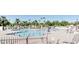 Outdoor community pool area with many patrons swimming in the pool at 515 S Saguaro Way, Mesa, AZ 85208