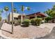 Charming home exterior boasts a covered carport and lush landscaping at 515 S Saguaro Way, Mesa, AZ 85208