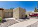 Exterior view of the home showing stucco walls, desert landscaping, and a private drive at 515 S Saguaro Way, Mesa, AZ 85208