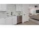 Bright kitchen featuring stainless steel appliances and white cabinetry at 515 S Saguaro Way, Mesa, AZ 85208