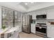 Modern kitchen with stainless steel appliances and a bright breakfast nook at 515 S Saguaro Way, Mesa, AZ 85208