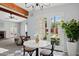 Bright breakfast nook with a marble table, french doors, and views of the landscaped backyard at 522 W Cambridge Ave, Phoenix, AZ 85003