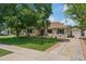 Charming home showcasing a well-manicured lawn and mature trees, offering great curb appeal at 522 W Cambridge Ave, Phoenix, AZ 85003