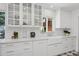 Bright kitchen featuring white cabinetry, farmhouse sink and light countertops at 522 W Cambridge Ave, Phoenix, AZ 85003