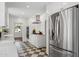 Modern kitchen featuring stainless steel appliances, white cabinets, and stylish backsplash at 522 W Cambridge Ave, Phoenix, AZ 85003