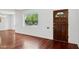 Inviting living room with hardwood floors and a front door at 522 W Cambridge Ave, Phoenix, AZ 85003