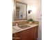 Charming bathroom vanity with unique, decorative sink and framed mirror at 5246 N 20Th St # B1, Phoenix, AZ 85016