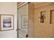 Modern bathroom with a glass shower, complemented by stylish tile work and built in niche at 5246 N 20Th St # B1, Phoenix, AZ 85016