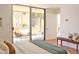 Spacious bedroom includes seating, decor, and access to a private outdoor patio at 5246 N 20Th St # B1, Phoenix, AZ 85016