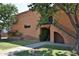 Brick apartment building exterior with mature trees, landscaping, and sidewalk access at 5246 N 20Th St # B1, Phoenix, AZ 85016