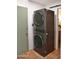 Modern laundry area with a stacked washer and dryer for space-saving convenience at 5246 N 20Th St # B1, Phoenix, AZ 85016