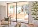 Bright living room with tile floors flows to outdoor patio seating through sliding glass doors at 5246 N 20Th St # B1, Phoenix, AZ 85016