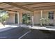 Assigned covered parking area with mature palm trees and convenient access to residences at 5246 N 20Th St # B1, Phoenix, AZ 85016