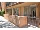 Cozy outdoor patio with a brick wall surround and an access gate, perfect for relaxing outside at 5246 N 20Th St # B1, Phoenix, AZ 85016
