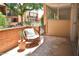 Outdoor patio featuring decorative chair and table and brick facade with beautiful neighborhood views at 5246 N 20Th St # B1, Phoenix, AZ 85016