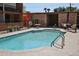 Inviting community pool with clear blue water, surrounded by lounge chairs and desert landscaping at 5246 N 20Th St # B1, Phoenix, AZ 85016