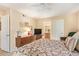 Relaxing bedroom with ensuite bathroom, a ceiling fan, and traditional furnishings at 6422 N 77Th Way, Scottsdale, AZ 85250