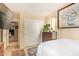 Cozy bedroom featuring a closet, wood floors, and stylish décor, creating a relaxing and inviting space at 6422 N 77Th Way, Scottsdale, AZ 85250