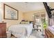 Bright bedroom with a large window and a ceiling fan at 6422 N 77Th Way, Scottsdale, AZ 85250