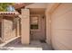 Welcoming front porch with a cozy seating area, and covered walkway at 6422 N 77Th Way, Scottsdale, AZ 85250