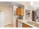 Bright kitchen features granite counters, light wood cabinets, and a large undermount sink at 6422 N 77Th Way, Scottsdale, AZ 85250