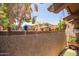 Relaxing outdoor patio area featuring a garden wall with a variety of plants and shade at 6422 N 77Th Way, Scottsdale, AZ 85250