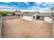 View of the spacious backyard with covered patio and block fencing at 6627 S 42Nd Pl, Phoenix, AZ 85042