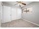 Bedroom with neutral carpet, closet, and a window with natural light at 6627 S 42Nd Pl, Phoenix, AZ 85042