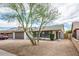 Charming home with gravel landscaping, garage, and tree in the front yard at 6627 S 42Nd Pl, Phoenix, AZ 85042