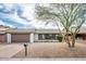 Charming single-story home with gravel landscaping, two-car garage and shade tree at 6627 S 42Nd Pl, Phoenix, AZ 85042