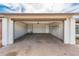 Spacious two car garage featuring shelving and lots of open space at 6627 S 42Nd Pl, Phoenix, AZ 85042