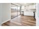 Bright kitchen featuring white cabinets, stainless steel appliances, and sliding glass door to patio at 6627 S 42Nd Pl, Phoenix, AZ 85042